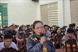 Party member Nguyen Thi Toan, a farmer from Mong Cai 2 ward of Quang Ninh province, offer opinions on the draft documents. (Photo: VNA)