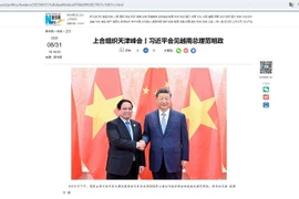 A Xinhua News Agency article reports on the meeting between Chinese President Xi Jinping and Vietnamese Prime Minister Pham Minh Chinh on August 31. (Photo: VNA)