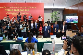 PM Pham Minh Chinh visits the press centre serving the 14th National Party Congress (Photo: VNA)