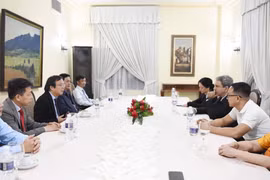 At the meeting between Chairman of the Members' Council and CEO of Vietnam Education Publishing House Nguyen Tien Thanh and Cuban Minister of Higher Education Walter Baluja García. (Photo: VNA)