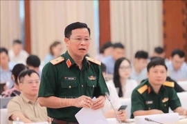 Major General Tong Van Thanh, Deputy Director of the Department of Information and Training under the General Department of Politics of the Vietnam People's Army addresses at the press conference. (Photo: VNA)