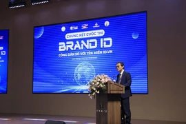 Do Quang Trung, head of the Vietnam Internet Network Information Centre's branch, delivers the opening speech at the final round of the website design competition “BrandID – Digital citizens with the id.vn domain.” (Photo: Ministry of Science and Technology)