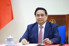Prime Minister Pham Minh Chinh speaks at the phone talks with Angolan President Joao Manuel Goncalves Lourenco on March 16. (Photo: VNA)