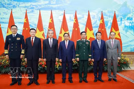 Prime Minister Pham Minh Chinh (centre) and the Vietnamese and Chinese ministers of foreign affairs, national defence and public security at the meeting in Hanoi on March 16. (Photo: VNA)