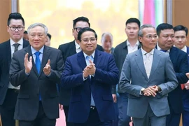 Prime Minister Pham Minh Chinh (middel, front) arriving at the conference (Photo: VNA)