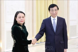 Vice President and General Secretary of the Vietnam Fatherland Front (VFF) Central Committee Nguyen Thi Thu Ha (L) and Wang Huning, Chairman of the National Committee of the Chinese People's Political Consultative Conference (CPPCC). (Photo: VNA)