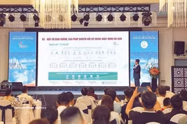 At a digital transformation implementation guidance programme in the tourism sector in July 2026. (Photo: VNA)