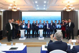 Delegates pose for a photo at the launch ceremony of the semiconductor alliance in Hanoi on November 27, 2025. (Photo: the organising board)