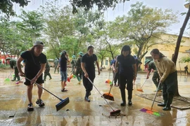 Urgent efforts are underway to clean up schools after floodwater recedes. (Photo: VNA) 