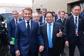 Prime Minister Pham Minh Chinh (second, right) meets with French President Emmanuel Macron on the sidelines of the 3rd UN Ocean Conference (UNOC3) in Nice, France on June 9. (Photo: VNA)