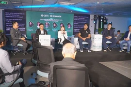 A panel discussion on Innovative and Creative Technology is one of the activities that attract participants at the event. (Photo: VietnamPlus)