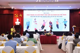 Panellists discuss measures to promote sports participation among secondary school girls in Vietnam at a seminar on June 18 in Hanoi. (Photo: Courtesy of the organisers)