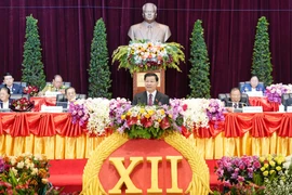 General Secretary of the Lao People's Revolutionary Party Thongloun Sisoulith delivers the opening speech at the opening session of the 12th National Congress of the Lao People’s Revolutionary Party (LPRP) on January 6. (Photo: VNA broadcasts)