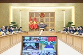 Prime Minister Pham Minh Chinh chairs an online conference with central provinces and cities on the “Quang Trung Campaign” on January 7. (Photo: VNA)