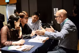 Australian and Vietnamese food enterprises discuss partnership on March 19. (Photo: VNA)