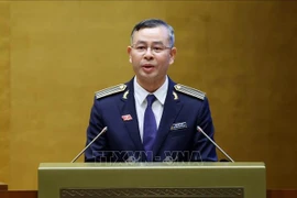 Auditor General Ngo Van Tuan delivers a report on the performance of the State Audit Office of Vietnam during the 2021–2026 tenure. (Photo: VNA)