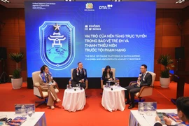 The discussion on the role of online platforms in protecting children and adolescents from cybercrime in Hanoi on October 25 (Photo: nhandan.vn)