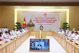 Prime Minister Pham Minh Chinh speaks at the national conference on the organisation of the high school graduation examination on June 18 (Photo: VNA)