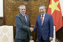 State President To Lam (right) receives Belarusian Ambassador to Vietnam Uladzimir Baravikou on July 3, 2024. (Photo: VNA)