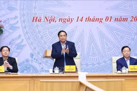 Prime Minister Pham Minh Chinh (standing) on January 14 chairs the sixth meeting of the National Steering Committee for the implementation of Vietnam’s commitments at the 26th United Nations Climate Change Conference of the Parties (COP26). (Photo: VNA)