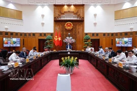 At the meeting of standing Government members on March 18, 2026 (Photo: VNA)