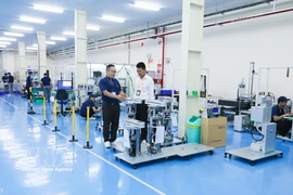 A production line assembling wafer transfer robots for the semiconductor industry at TAZMO Vietnam Co. Ltd. in Long Hau Industrial Park, Tay Ninh province (Photo: VNA)