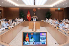 Deputy Prime Minister Nguyen Chi Dung chairs the first meeting of the inter-agency task force for coordinating smart city construction and development in Hanoi on July 16. (Photo: VNA)