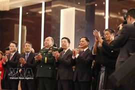 From left: Minister of Science and Technology Nguyen Manh Hung (fourth), Deputy Prime Minister Bui Thanh Son (fifth), Japanese Ambassador Ito Naoki (sixth), and delegates at the reception in Hanoi on March 3 to celebrate the 66th birthday of His Majesty Emperor Naruhito. (Photo: VNA)