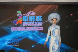 An ao dai showcase provided a striking highlight at the morning event on March 3. (Photo: VNA)
