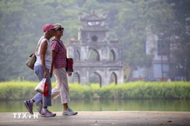 Foreign tourists are in Hanoi's downtown area. (Photo: VNA)