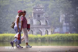 Foreign tourists are in Hanoi's downtown area. (Photo: VNA)