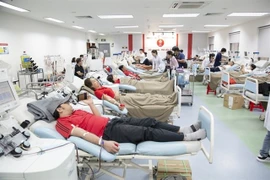 Youngsters donate blood at the National Institute of Haematology and Blood Transfusion in Hanoi. (Photo courtesy of NIHBT)