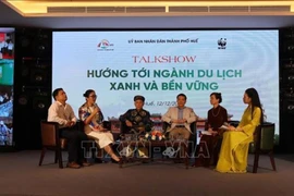 A view of the talkshow within the conference in Hue on December 12 to review and discuss strategic orientations for the 2023-2025 roadmap to reduce plastic waste in the local tourism sector. (Photo: VNA)