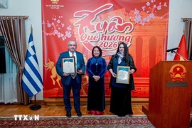 Vietnamese Ambassador to Greece Pham Thi Thu Huong (centre) presents the 11th National External Information Service Awards to Greek winners. (Photo: VNA)