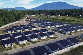 This aerial photo shows rows of houses with Mt. Marapi in the background in Nagari Rambatan, West Sumatra, Sunday, July 20, 2025. The houses were built by the government to accommodate victims of the Marapi eruption. (Antara Photo/Iggoy el Fitra)