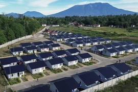 This aerial photo shows rows of houses with Mt. Marapi in the background in Nagari Rambatan, West Sumatra, Sunday, July 20, 2025. The houses were built by the government to accommodate victims of the Marapi eruption. (Antara Photo/Iggoy el Fitra)