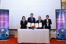 Representatives from Dassault Systèmes and Viettel pose for a photo after signing the MoU. (Photo courtesy of Dassault Systèmes)