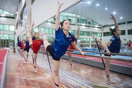 The Vietnamese gymnastics team train hard for the upcoming SEA Games 33. (Photo: hanoimoi.vn)