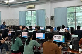 People take the test on computers for A1 driving licence in Tây Ninh province. (Photo: VNA)