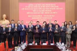 President of the Vietnam Fatherland Front (VFF) Central Committee Bui Thi Minh Hoai (front, seventh from left) and delegates to the 13th Vietnam–China People’s Forum poses for a group photo at their meeting in Hanoi on November 25. (Photo: VNA)