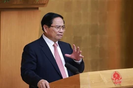 Prime Minister Pham Minh Chinh addresses the meeting (Photo: VNA)