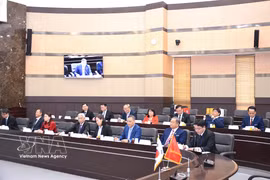 Representatives from four Vietnamese educational establishments at the working session (Photo: VNA)