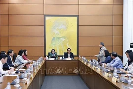 At a discussion session (Photo: VNA)