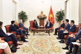 Minister of Foreign Affairs Le Hoai Trung meets with Canada's Minister of International Trade Maninder Sidhu on February 12, 2026. (Photo: Ministry of Foreign Affairs)