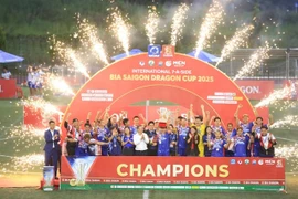 Thailand players and officials celebrate their International Seven-a-side Football Tournament victory. (Photo of VietFootball)