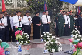 Deputy Prime Minister Pham Thi Thanh Tra and delegates at the reburial ceremony. (Photo: VNA)