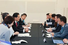 Vietnamese Minister of Industry and Trade Nguyen Hong Dien holds a bilateral meeting with State Minister of the Cabinet Office of Japan Kazuchika Iwata in Melbourne, Australia, on November 20, 2025 on the sidelines of the ninth Commission Meeting of the Comprehensive and Progressive Agreement for Trans-Pacific Partnership (CPTPP). (Photo: VNA)