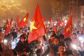 Hanoians celebrate the Vietnamese national team's victory. (Photo: VNA)