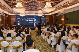 Participants at a conference on digital assets in Hanoi on December 10. (Photo: VNA)
