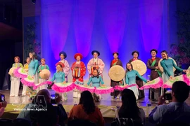 An ao dai fashion show at the grand music programme on March 8, presented by the Vietnamese ao dai heritage club in Belgium in coordination with the UGVB Women’s Association. (Photo: VNA)